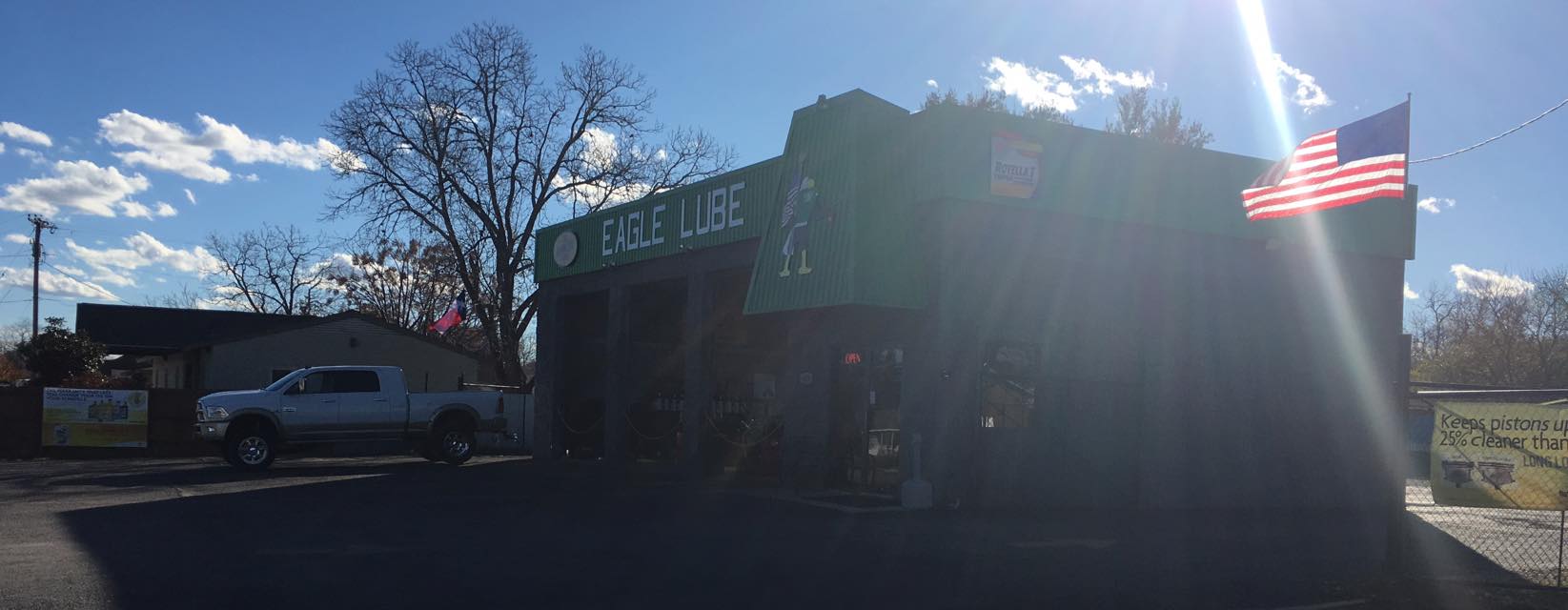 Picture of the store front with a sunset in the background.